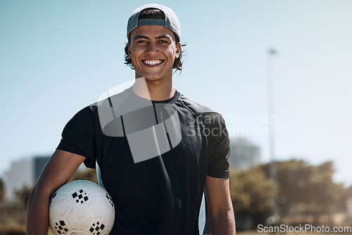 Image of Man, soccer ball or fitness on sports field, training center or exercise club and wellness goals, health target or winner mindset. Portrait, smile or happy football coach or workout personal trainer