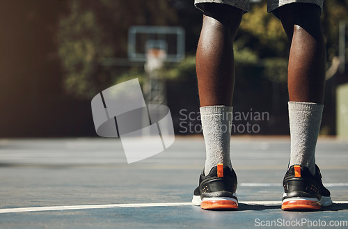 Image of Basketball, sneakers and athlete black man standing on community sports court for match, motivation and streetball memory. Male player outside in USA with sport shoes on feet for fitness and exercise