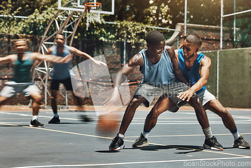 Image of Training, basketball and friends at a basketball court, having fun in competitive game and laughing, silly and cheerful. Energy, sports and basketball players competing for ball in bonding workout