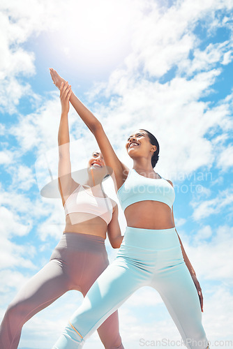 Image of Pilates, personal trainer and woman client learning wellness, support and workout exercise accountability or trust on blue sky clouds. Stretching people, mentor or coach training with sun lens flare