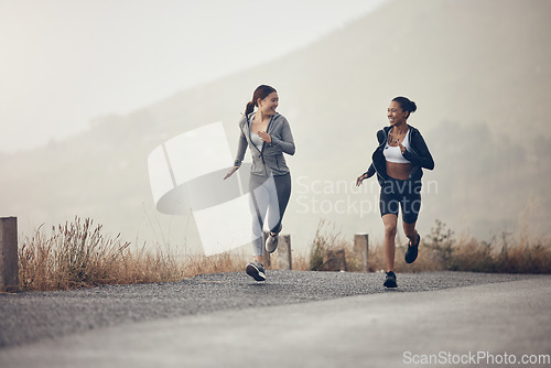 Image of Running, fitness and exercise with a woman friends in sport on a road or street for cardio training in the morning. Workout, health and endurance with a female runner and friend in the mountains