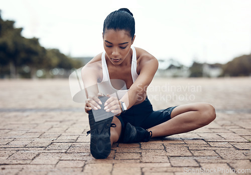 Image of Fitness, sports and woman stretching legs in warm up to start training, exercise and cardio workout in Lisbon. Runner, Athlete and flexible girl holding running shoes for a healthy hamstring stretch