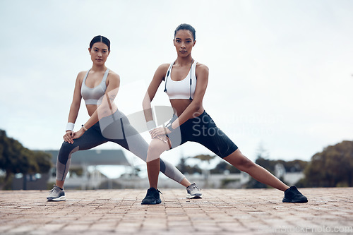 Image of Exercise, women and stretching for wellness, outdoor and training for fitness, health and in sportswear. Female, girl and practice for workout, warm up and outside being focus, healthy and for cardio