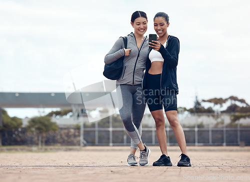 Image of Women, phone or fitness selfie after training, workout or exercise in Colombian stadium. Smile, happy or sports runners or friends on mobile 5g technology for health data analysis or wellness success