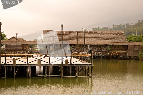 Image of Wooden bridge and house