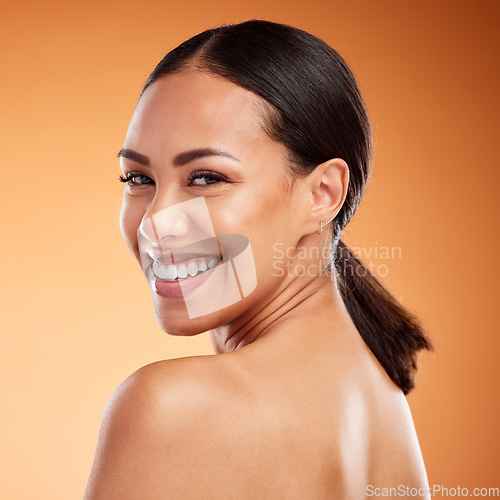 Image of Face, beauty and skincare for woman with smile for facial health against a brown mockup studio background. Young model happy about natural wellness, clean teeth and dermatology with mock up space