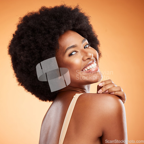 Image of Skincare, cosmetics and black woman with smile, being happy, confident and brown studio background for body care or being bold for natural beauty. Makeup, female smooth skin or girl afro for wellness