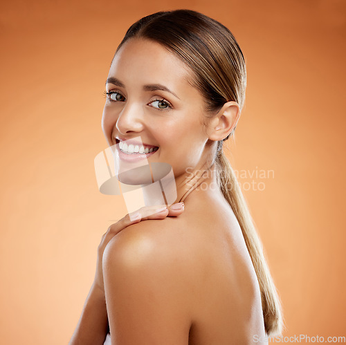 Image of Beauty, skincare and portrait of a woman grooming in studio, happy, relax and wellness against a brown background. Body, cleaning and female hygiene with model enjoying selfcare, fresh and treatment