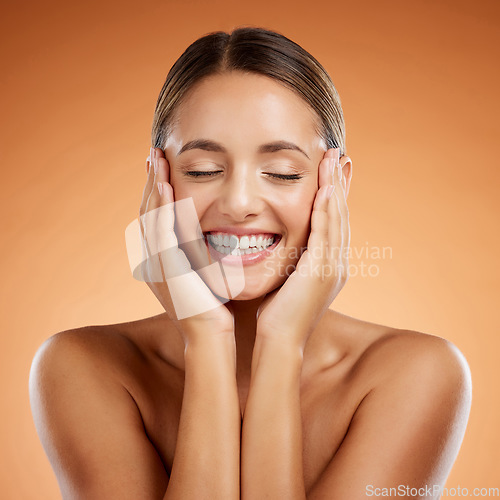 Image of Skincare, beauty and woman excited about face makeup against mockup orange studio background. Happy, smile and young girl model with facial cosmetics and wellness from dermatology with mock up space