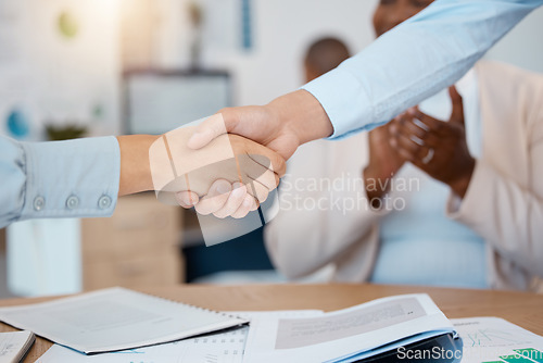 Image of Collaboration, handshake, agreement and meeting for project, contract and approve business application. Close up, employees and teamwork for cooperation in construction office, partnership and deal