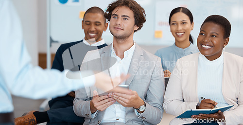 Image of Audience, listening and training with a team in a meeting, seminar or workshop for learning and development. Teamwork, coaching and growth with a crowd sitting in a boardroom for strategy or upskill