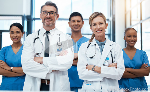 Image of Doctors, nurses and team portrait in hospital, clinic or medical office. Teamwork, diversity and healthcare professionals standing together with arms crossed in confidence, collaboration or support.