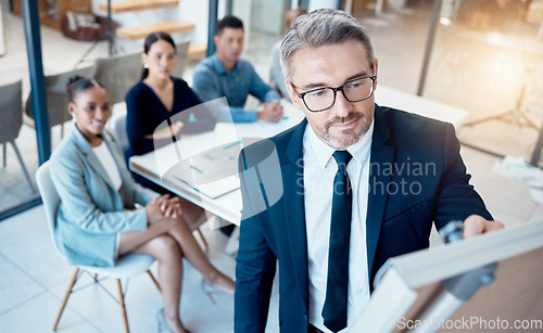 Image of Presentation, meeting and business people for finance strategy, marketing coaching or company innovation brainstorming idea. Manager writing on whiteboard in a staff team building company workshop