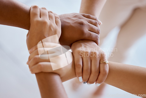 Image of Hands, together and solidarity with a group of people strong in unity from above for teamwork or collaboration. Trust, support and community with a team or partnership holding a wrist for motivation