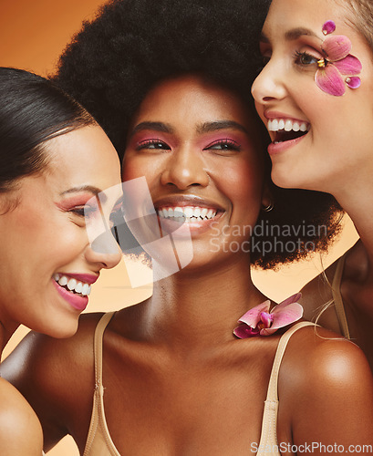 Image of Women, beauty and flowers, makeup and diversity of models on orange studio background. Skincare, face and happy, young and elegant female group posing together with cosmetics, orchids or pink plants.