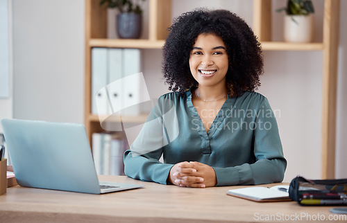 Image of Portrait of a black woman, office desk and professional business employee consultant in the workspace. Corporate finance worker, working with a laptop and notebook in modern marketing startup company