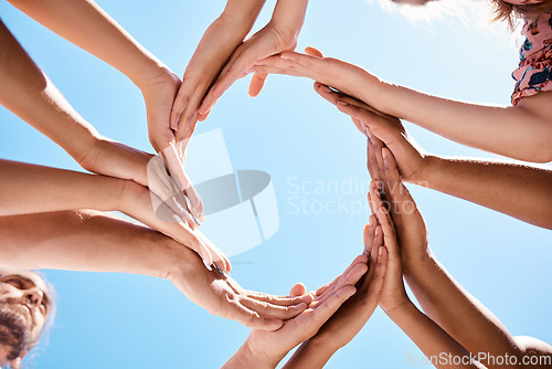 Image of Hands, circle and community support hand sign of people and friends outdoor with a blue sky. Happy, trust and hope of women and men together with diversity to show love, care and happiness