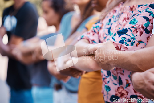 Image of Hands, solidarity and protest with a group of people standing in unity at a rally or demonstration. Community, human rights and teamwork with a movement ready to fight for freedom or stop a crisis