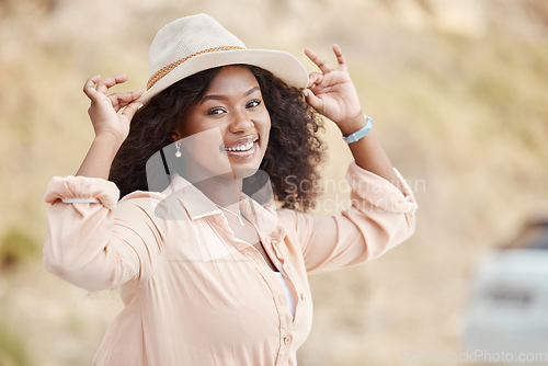 Image of Happy black woman on holiday, spring portrait on outdoor adventure and weekend lifestyle in Los Angeles. Summer fashion sun hat, young african girl on urban vacation and happiness in natural park