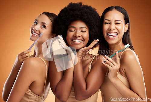 Image of Beauty, smile and dental with women and toothbrush for teeth, oral healthcare and hygiene. Orthodontics, lifestyle and diversity with girls against orange background for wellness, clean or dentistry