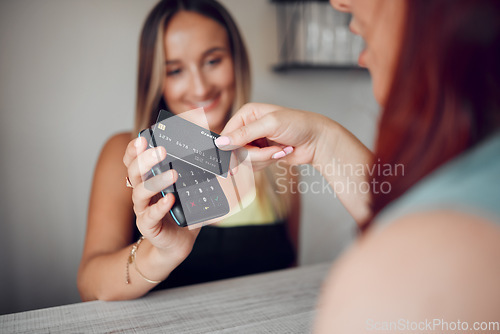 Image of Hands, woman and credit card tap to pay on electronic machine for wireless transaction at cafe. Hand of female in contactless payment tapping on scanner for purchase at a coffee shop or restaurant