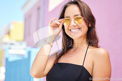 Image of Fashion, beauty and glasses with a woman in the city during a sunny summer day with a smile.