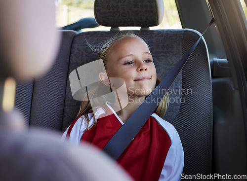 Image of Girl child, road trip and seatbelt in car while smiling looking out the window on journey to sports match. Safety, smile and happy kid passenger on fun travel trip with transportation in Australia