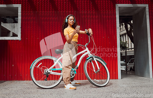 Image of Woman, bike and phone in city travel with music headphones, 5g podcast or radio. Thinking model, mobile and fashion student on eco friendly, carbon footprint or future Colombian environment transport