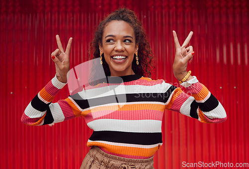 Image of Peace sign, comic and black woman against red wall in the city of Amsterdam for holiday, travel and adventure. Thinking, fashion and young girl with crazy, and funny idea on vacation with smile