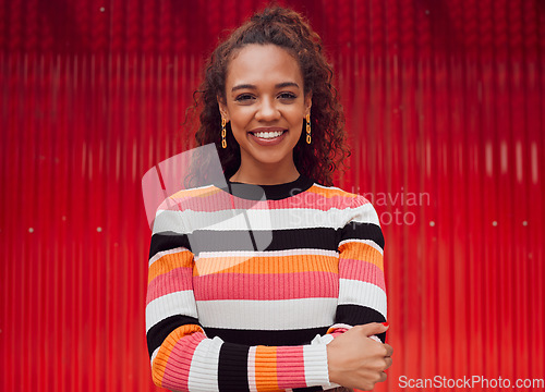 Image of Fashion, smile and woman against a red background in the city during a holiday in Amsterdam. Portrait of a happy, African and cool girl on a travel vacation for freedom, adventure and happiness