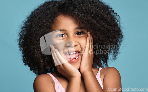 Image of .Happy girl, child and excited surprise face of a kid in a studio with happiness and wow expression. Portrait of a young model from Chicago with natural hair showing a smile, omg and shock pose.