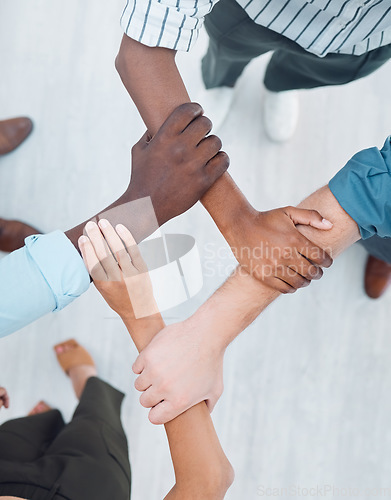 Image of Diversity, support and teamwork with hands of business people holding arms for community, global networking or mindset goals. Vision, innovation and workshop with employee for mission, growth or hope