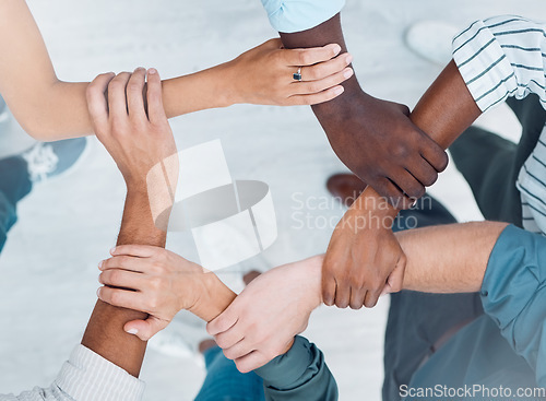 Image of Wrist hands, team building and business people support diversity, group and collaboration, cooperation and community mission. Above solidarity, partnership and motivation of goals, trust and teamwork