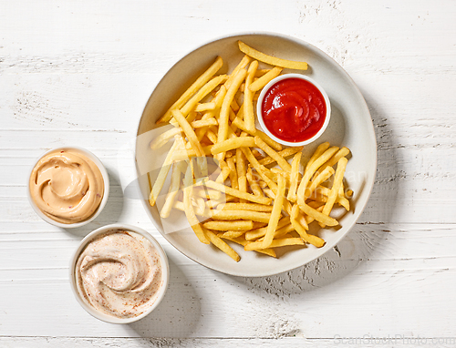 Image of french fries and dip sauces