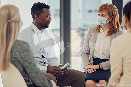 Image of Covid, corporate and employees in a meeting for business, networking and collaboration in office at work. Team of workers, business people and staff talking with face mask at a professional company