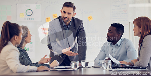 Image of Businessman, speaker or presentation meeting with paper chart, infographic documents and survey research. Talking mentor, manager or leader in corporate training, diversity teamwork and collaboration