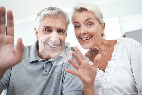 Image of Senior couple, wave and home video call, talking or speaking or discussion. Retirement, happy elderly man and woman greeting on online, web or internet video conference in house together with smile