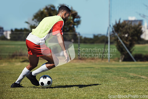 Image of Man, running or soccer ball on grass field for sports, training or workout in competition match. Football player, athlete or fitness person in workout, training or exercise for wellness or speed game