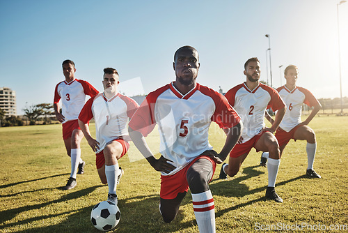 Image of Soccer, men and team stretching on field before sports game or training exercise. Health, fitness and teamwork, football competition players stretch on grass together for strong performance in match.