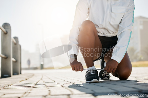 Image of Shoes tie, sport and woman outdoor running for athlete exercise, workout and a summer run. Sports, runner training and health wellness cardio of a fitness person busy with healthy lifestyle practice