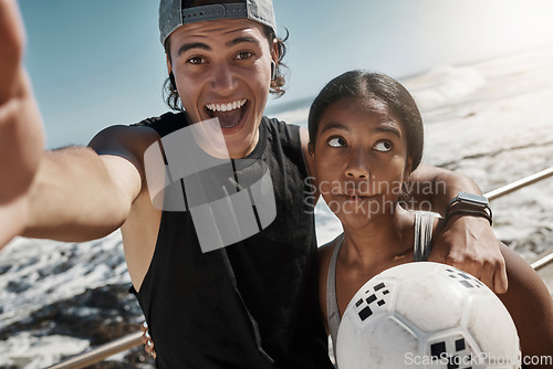 Image of Soccer ball, couple and fun sports selfie by beach, sea or ocean after fitness, workout and training. Portrait, smile and happy man and comic woman in photograph pov after football exercise in Brazil