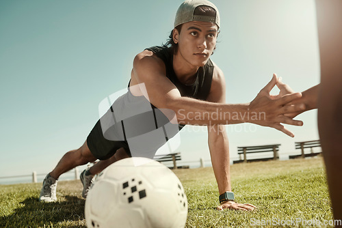 Image of Soccer, fitness and friends doing push up on grass in summer holidays for training, exercise and body workout. Football, healthy and young men hands touching while exercising outdoors in Sao Paulo