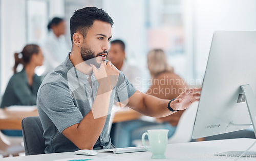 Image of Startup, office and man at desk with computer working on creative project for marketing or advertising business. Businessman, graphic designer or software developer working on digital transformation.