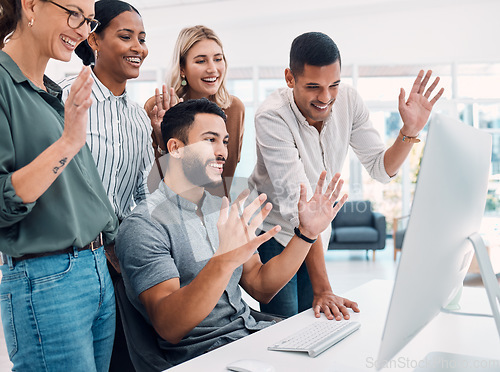 Image of Video conference, business and employees with wave while talking on a computer together at work. Happy, corporate and young group of marketing employees greeting on a webinar on a pc in an office