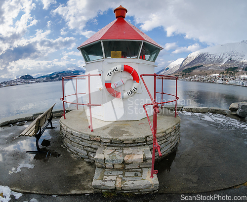 Image of A Quaint Lighthouse on a Dock