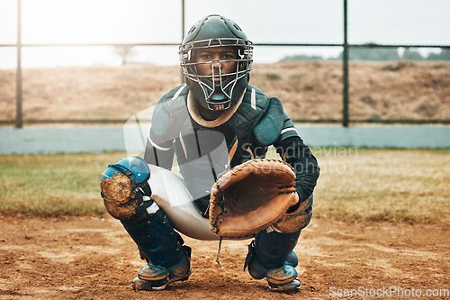 Image of Baseball, catcher and sports with man on field at pitchers plate for games, fitness and health in stadium park. Helmet, glove and uniform with athlete training for workout, achievement and exercise
