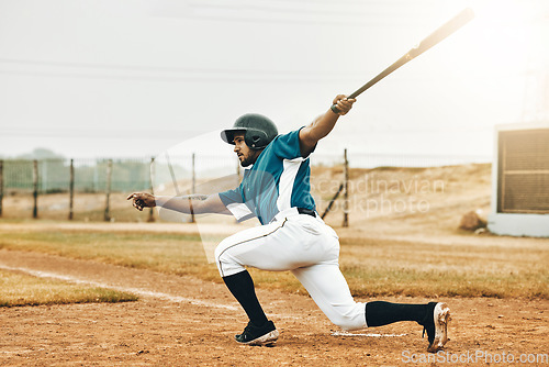 Image of Baseball, sports and homerun with a man athlete or batter hitting and scoring during a game outdoor on a pitch. Sport, fitness and exercise with a male player on a field for training or a match
