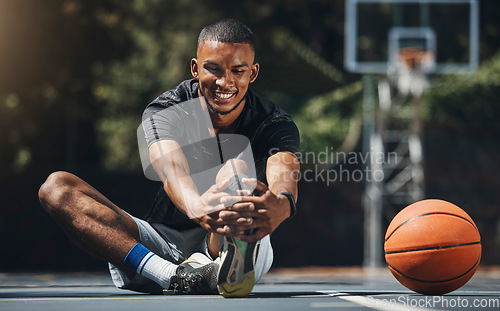 Image of Training, basketball player and man stretching legs in outdoor community court, muscle energy and healthy sports game performance. Happy, strong and young male athlete warm up exercise in competition