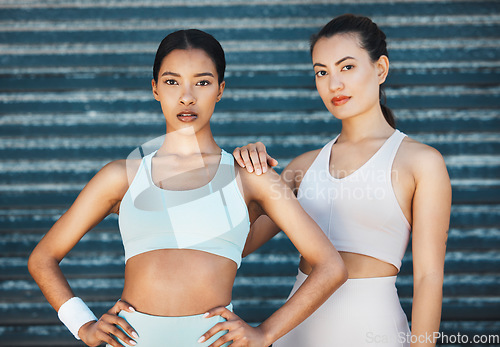 Image of Motivation, fitness and women training against a wall in the city for health, sports and body goal. Portrait of athlete friends with support, solidarity and care for exercise, workout and cardio