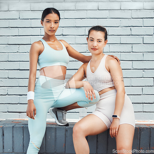 Image of Fitness, portrait and women training in the city for motivation, body goal and collaboration together. Young athlete friends doing an outdoor cardio, exercise and workout for a healthy lifestyle